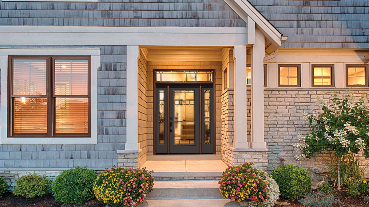 ThermaTru black entry door with sidelites and brown trim